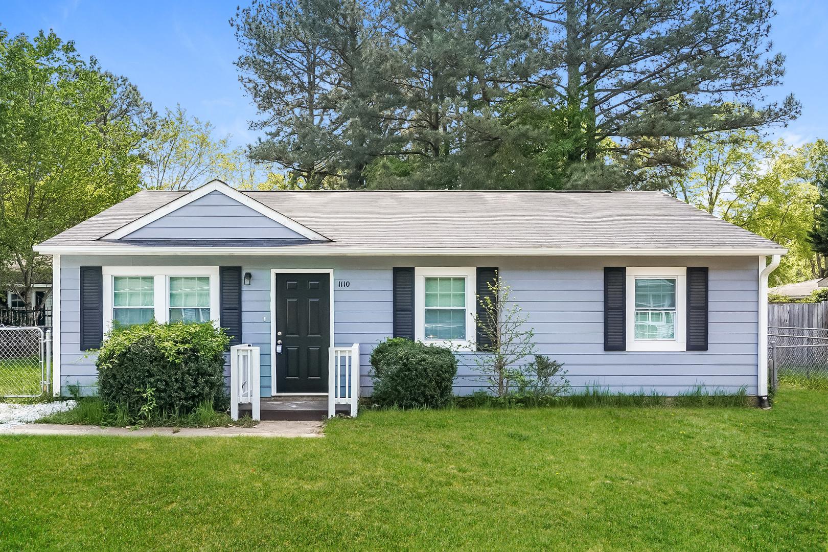 front view of a house with a yard