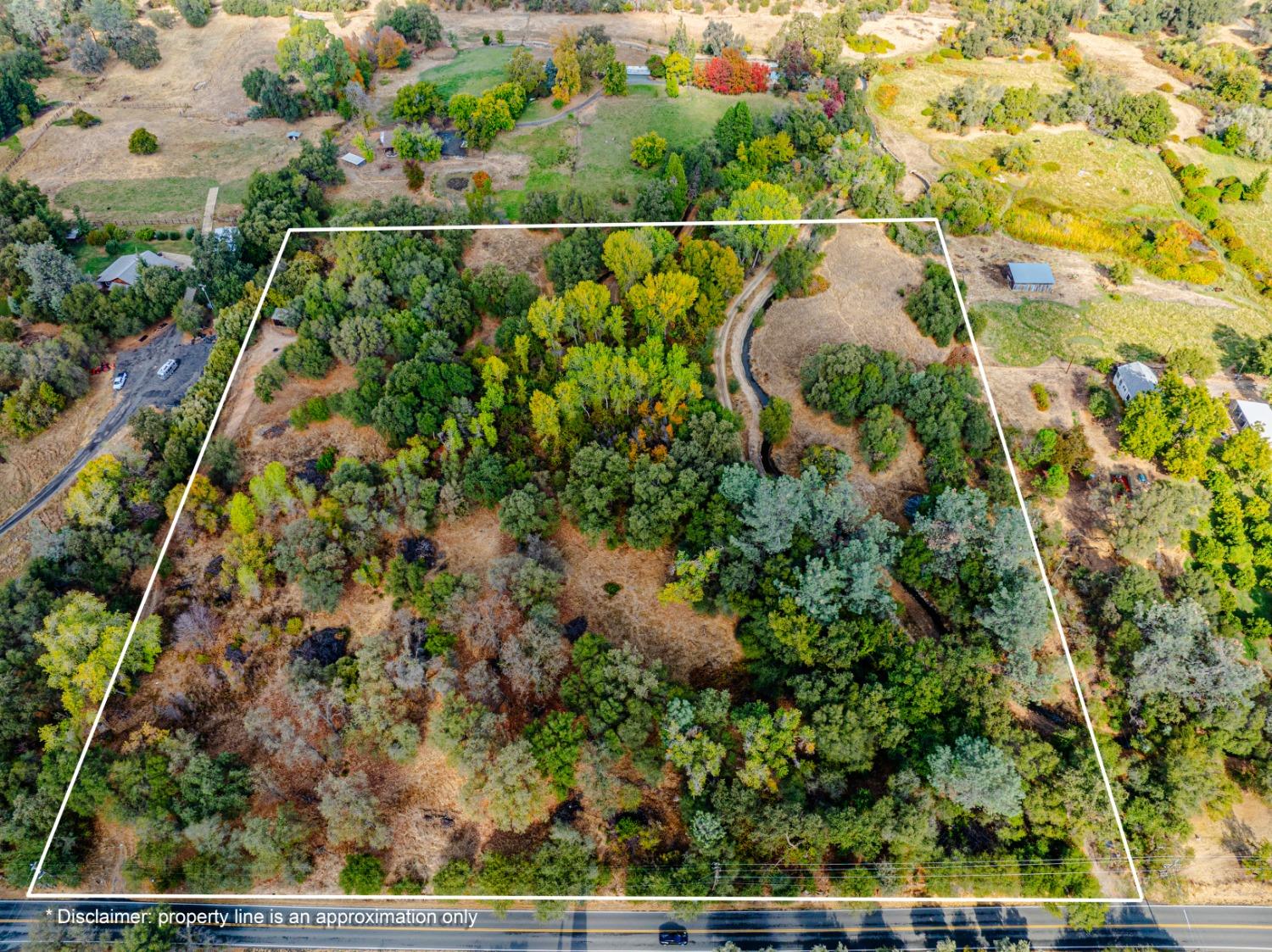 a view of a yard with a lake view