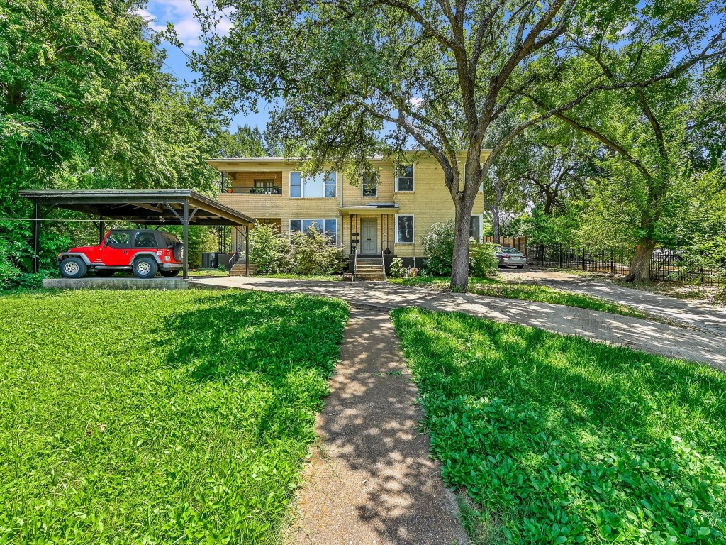 a front view of house with yard and green space