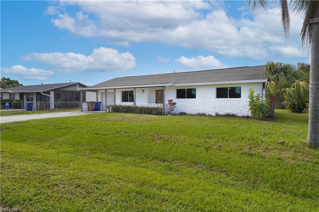 Ranch-style home with a front yard