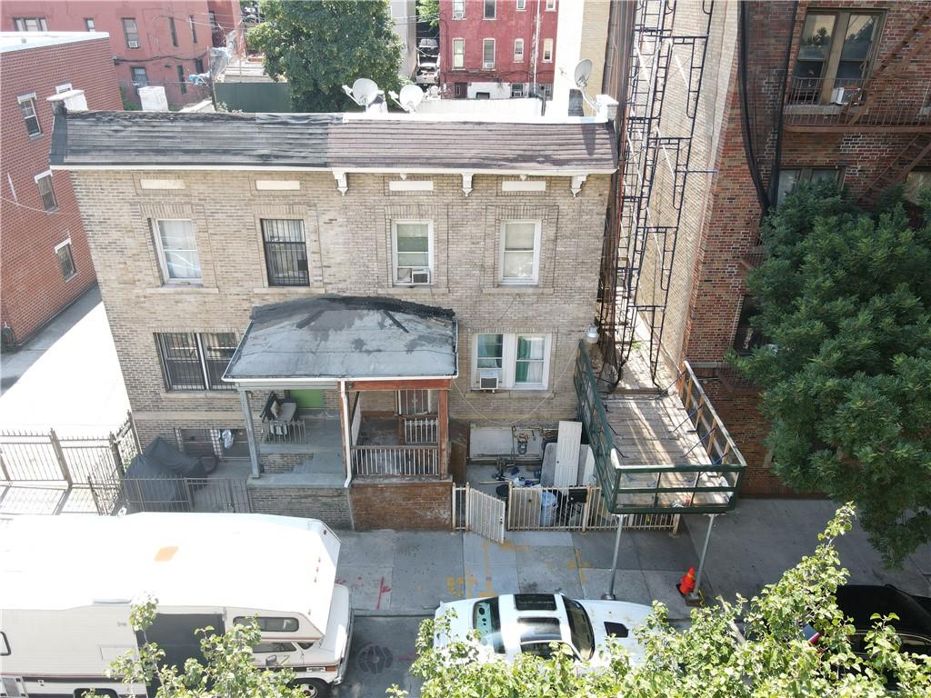 a aerial view of a house with balcony and patio