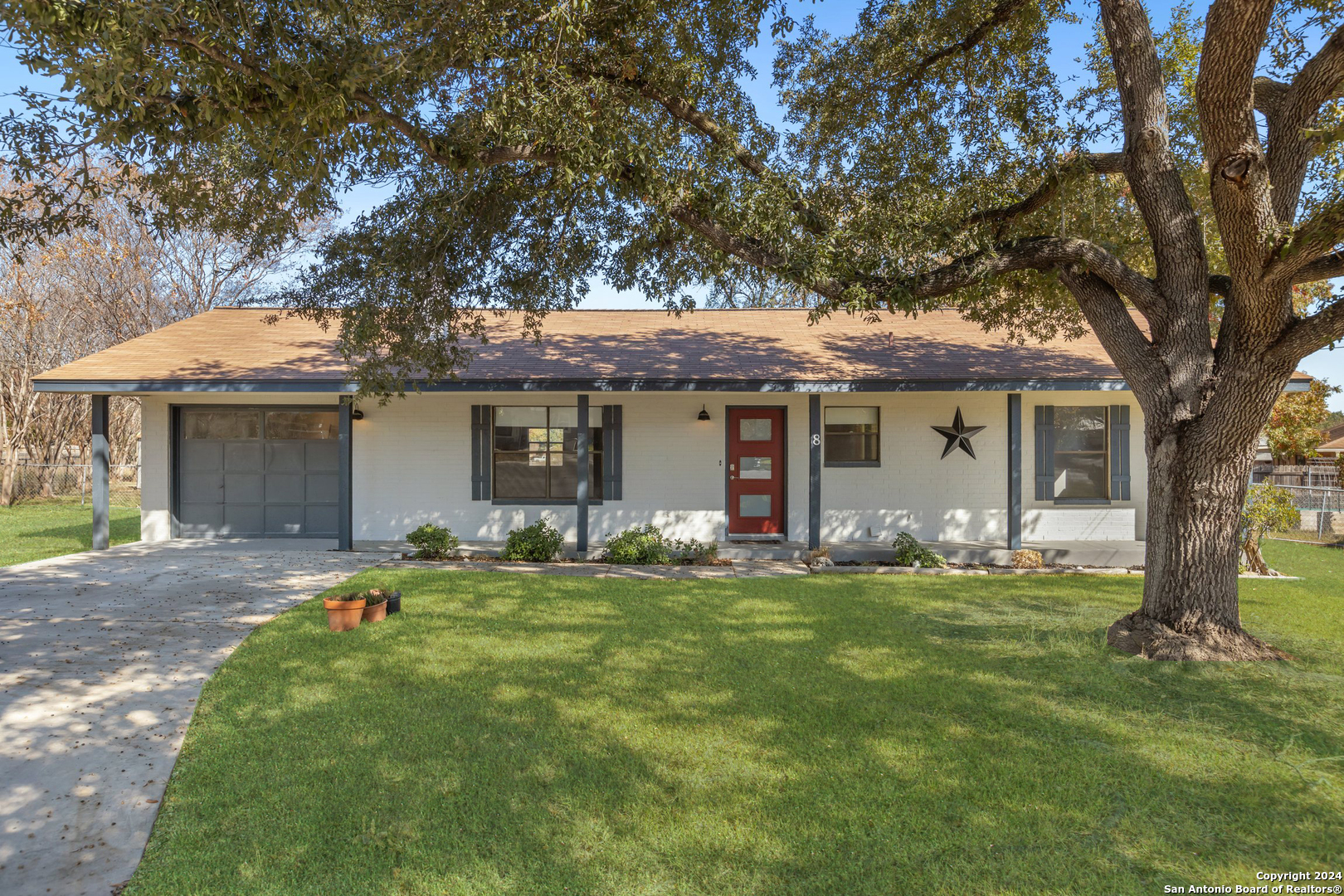 front view of a house with a yard