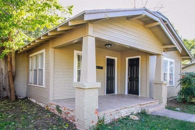 a front view of house with an outdoor space