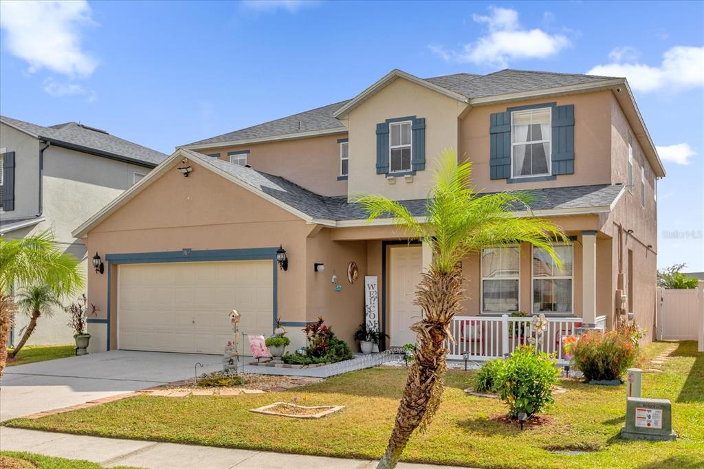 a front view of a house with a yard