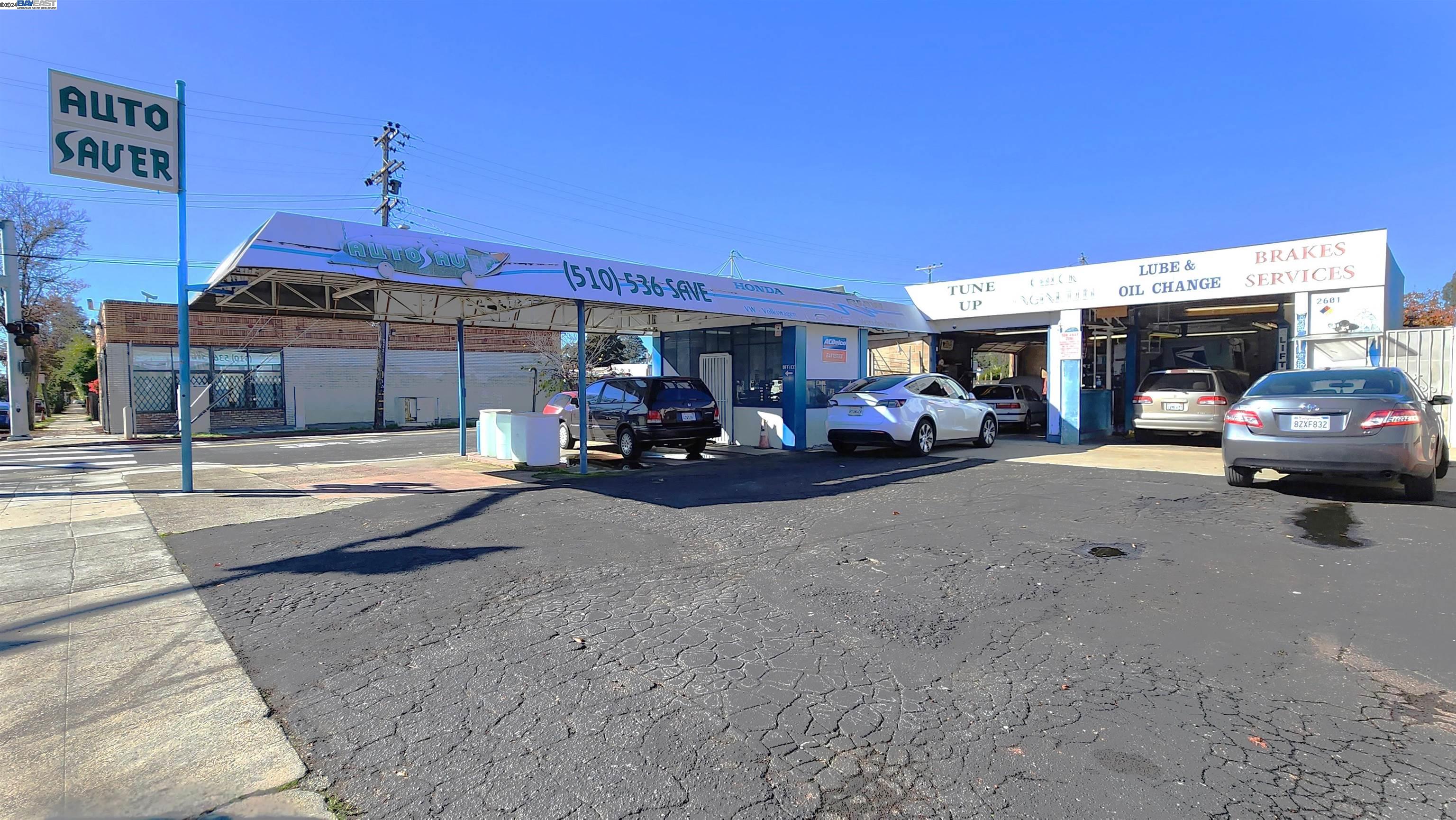 a view of a cars park in front of building