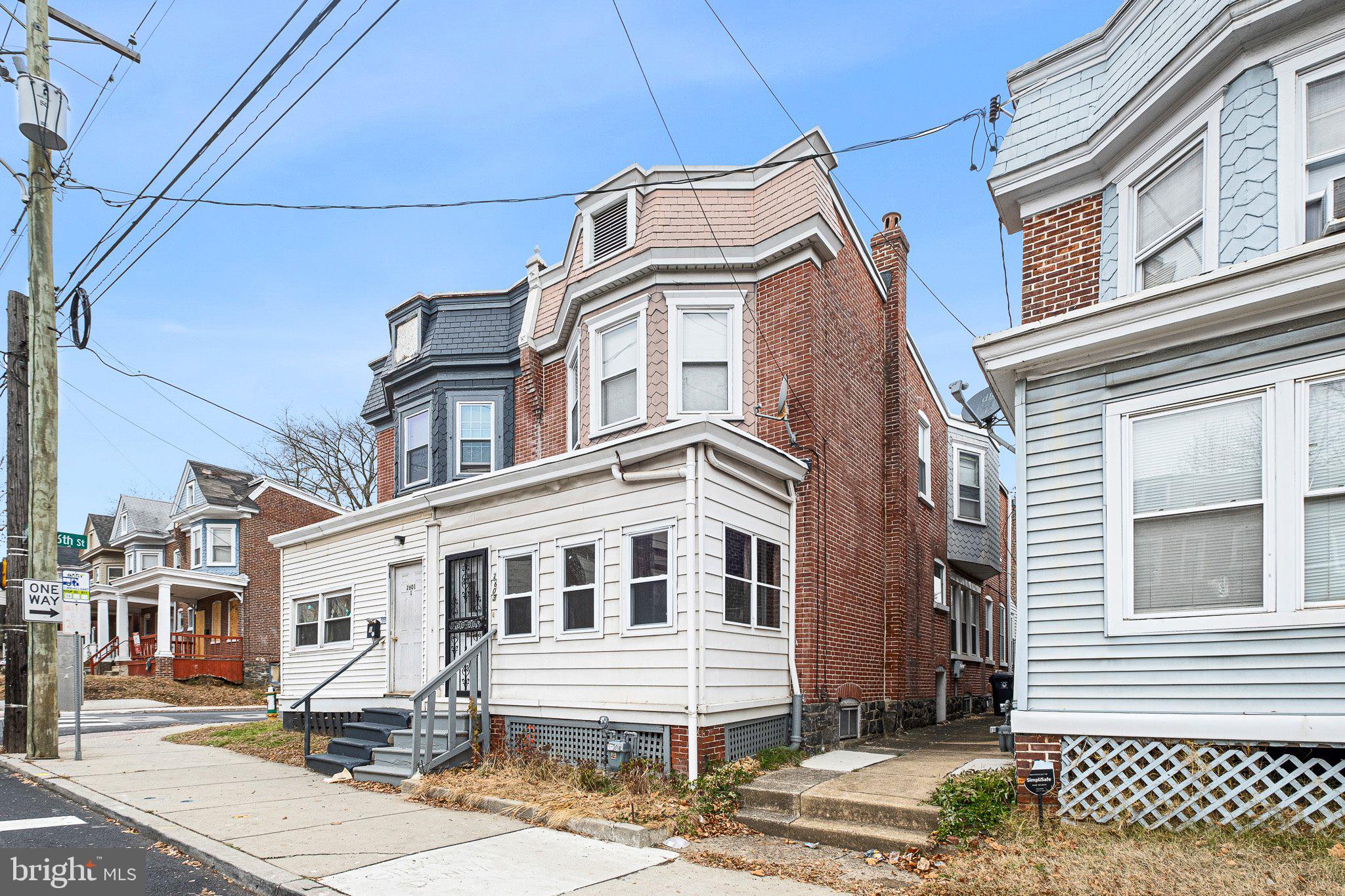 a front view of a residential houses with city street