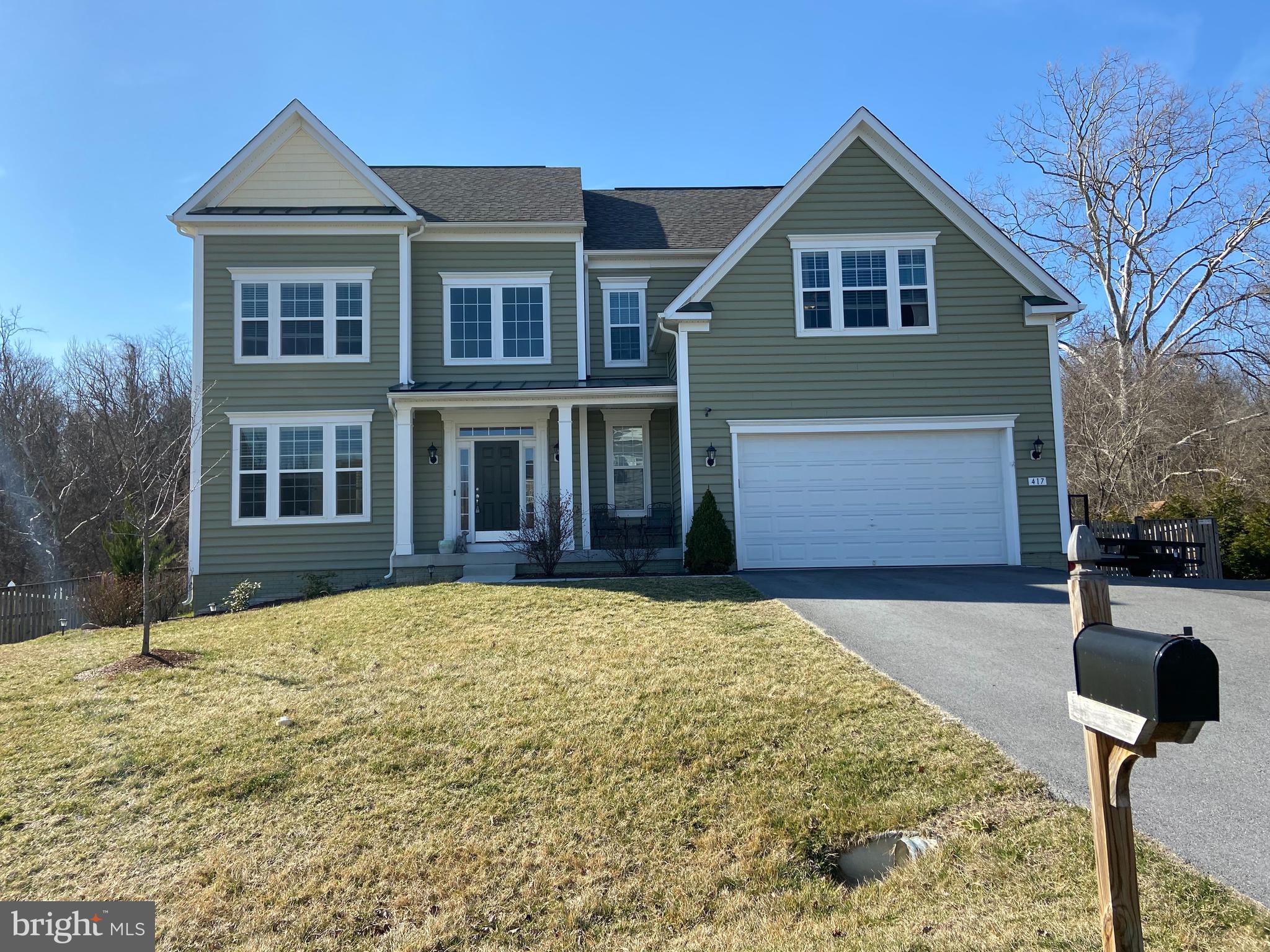 a front view of a house with parking area