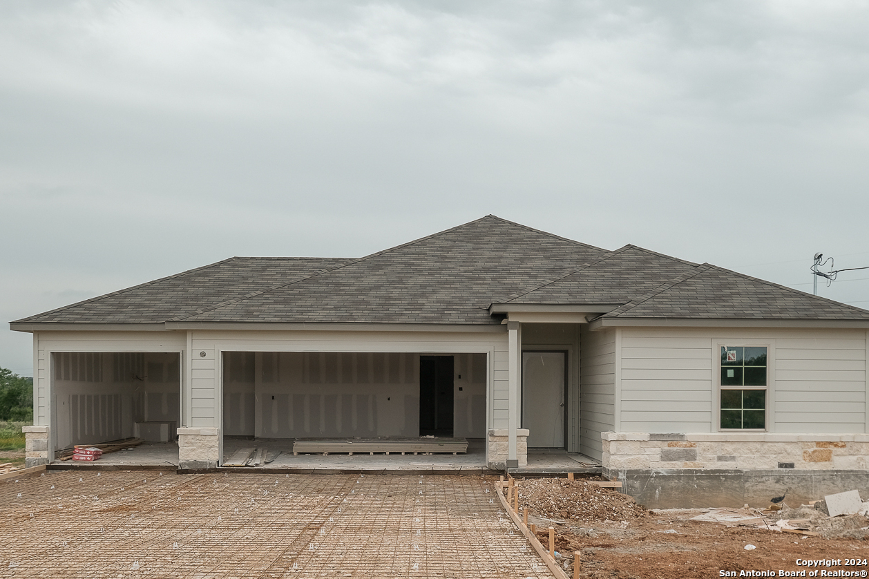 a front view of a house with yard