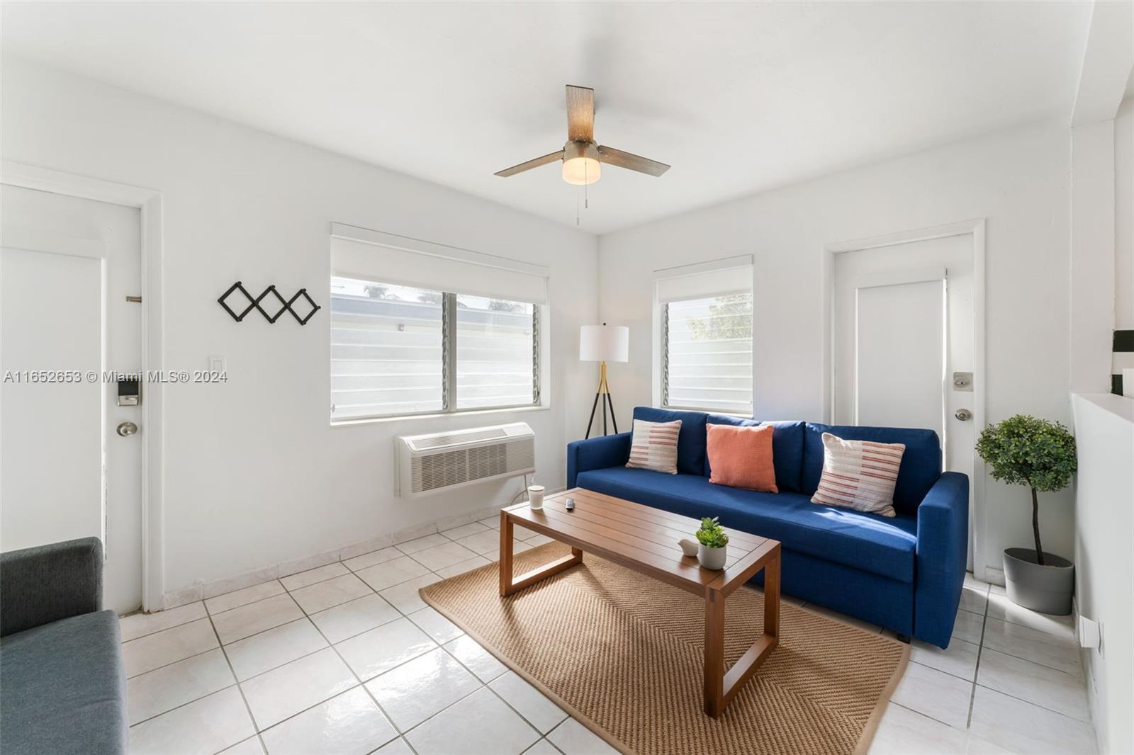 a living room with furniture and a window