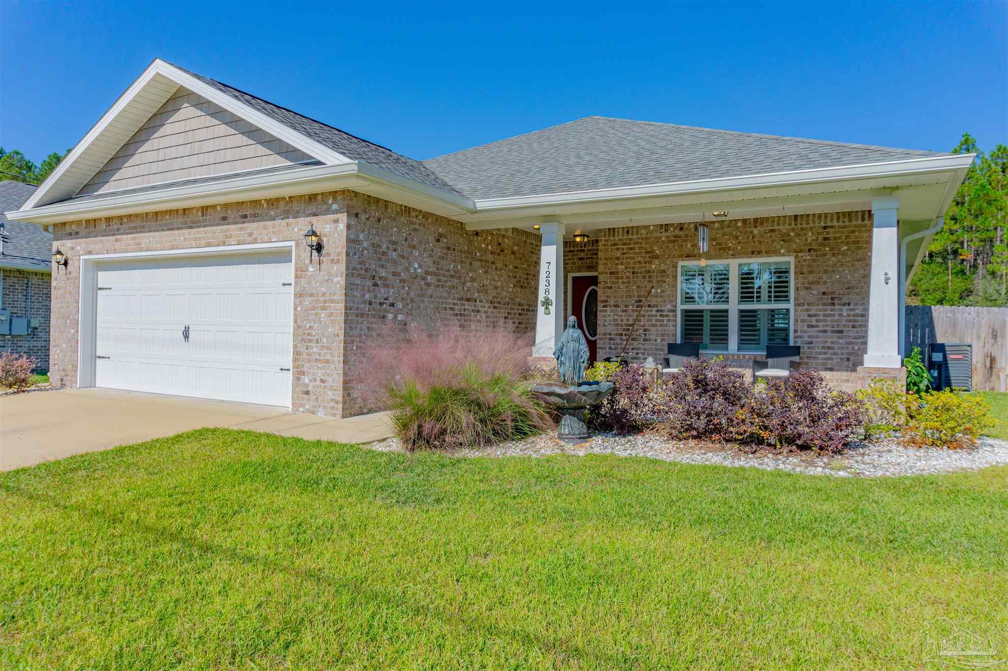 front view of a house with a yard