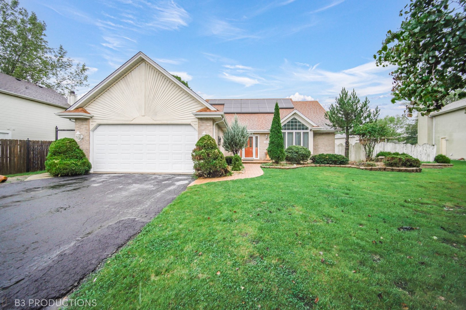 a view of a front of a house with a yard