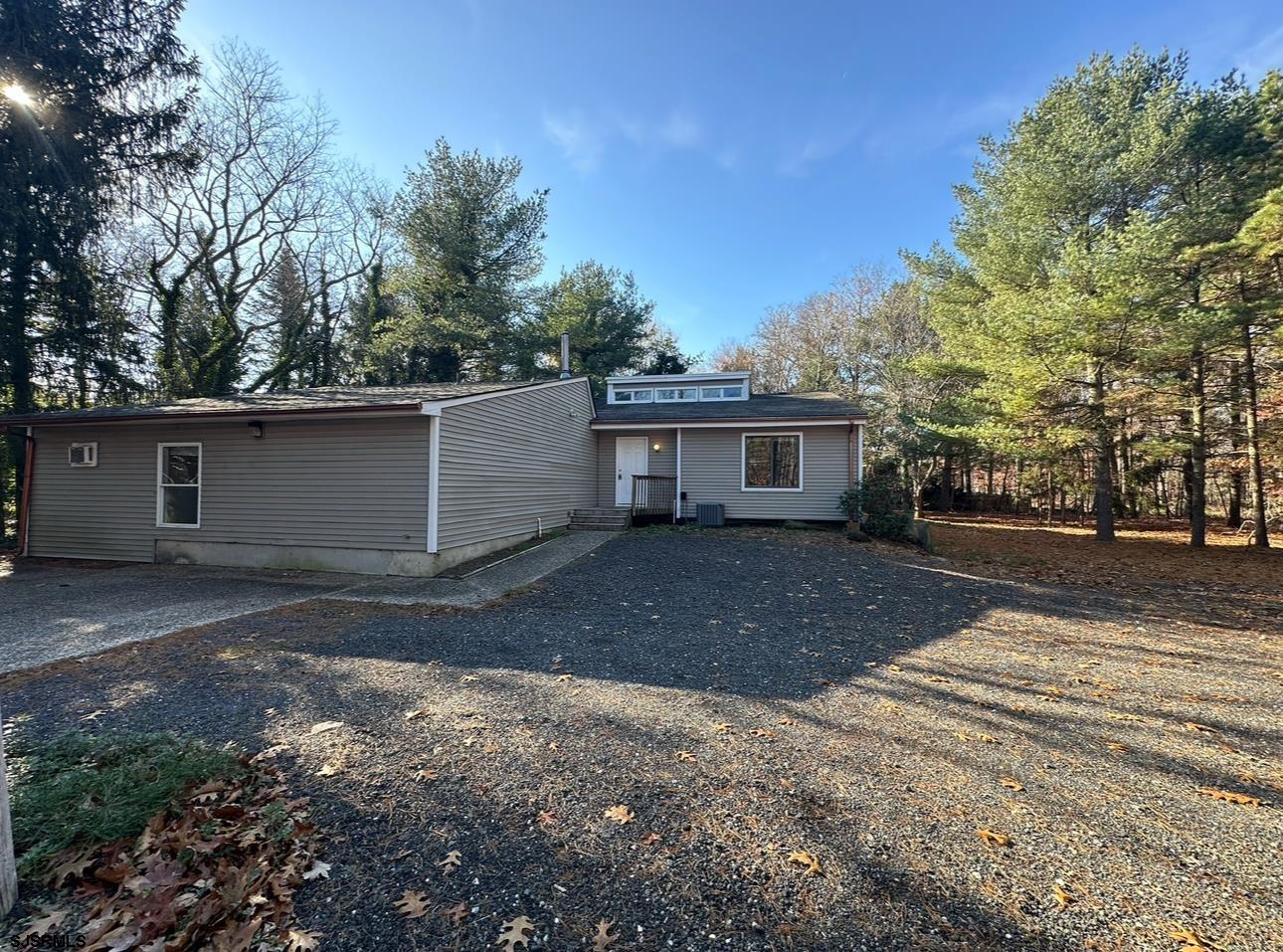 a front view of a house with a yard and a garage