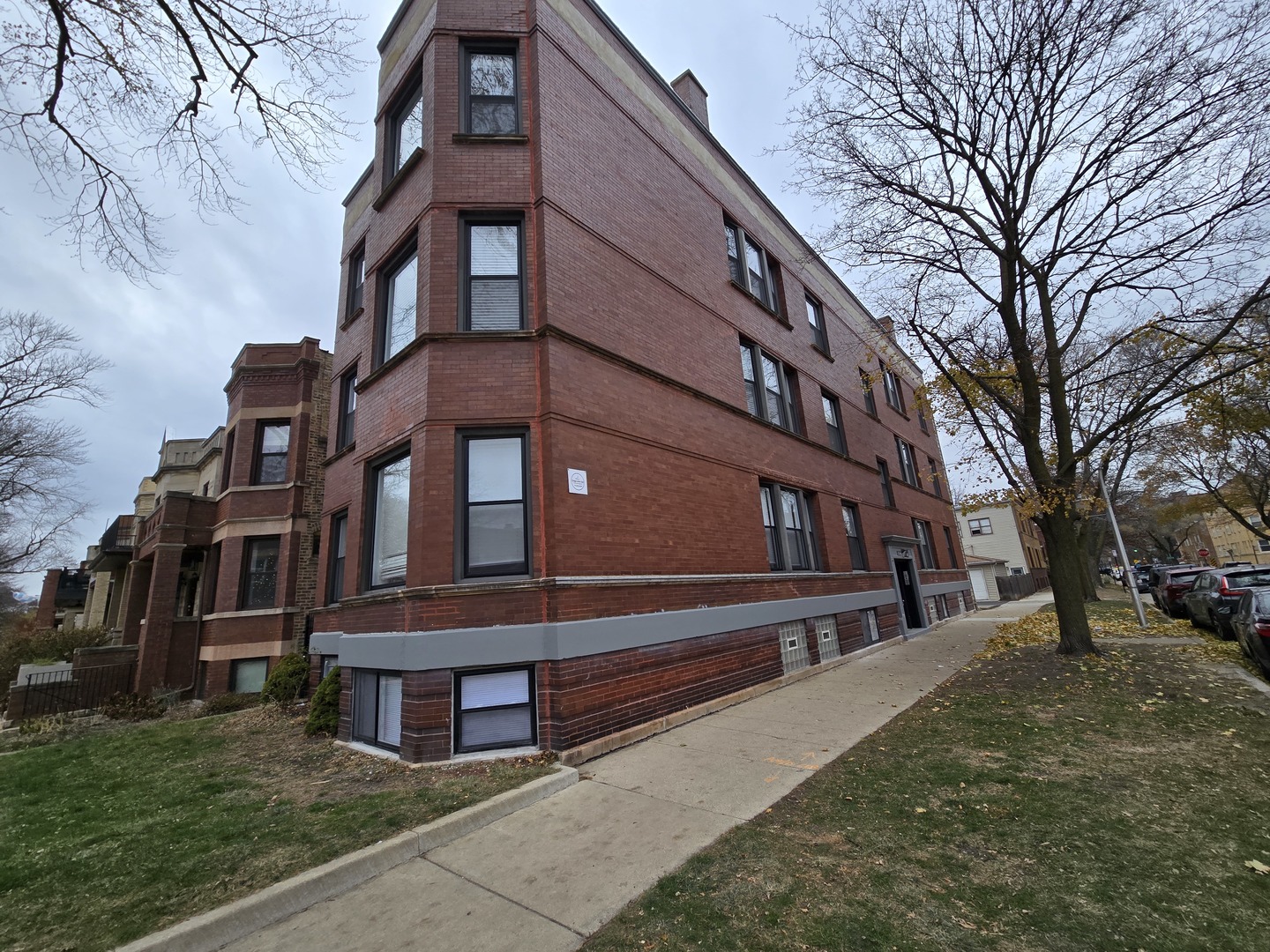 a view of a building with a yard