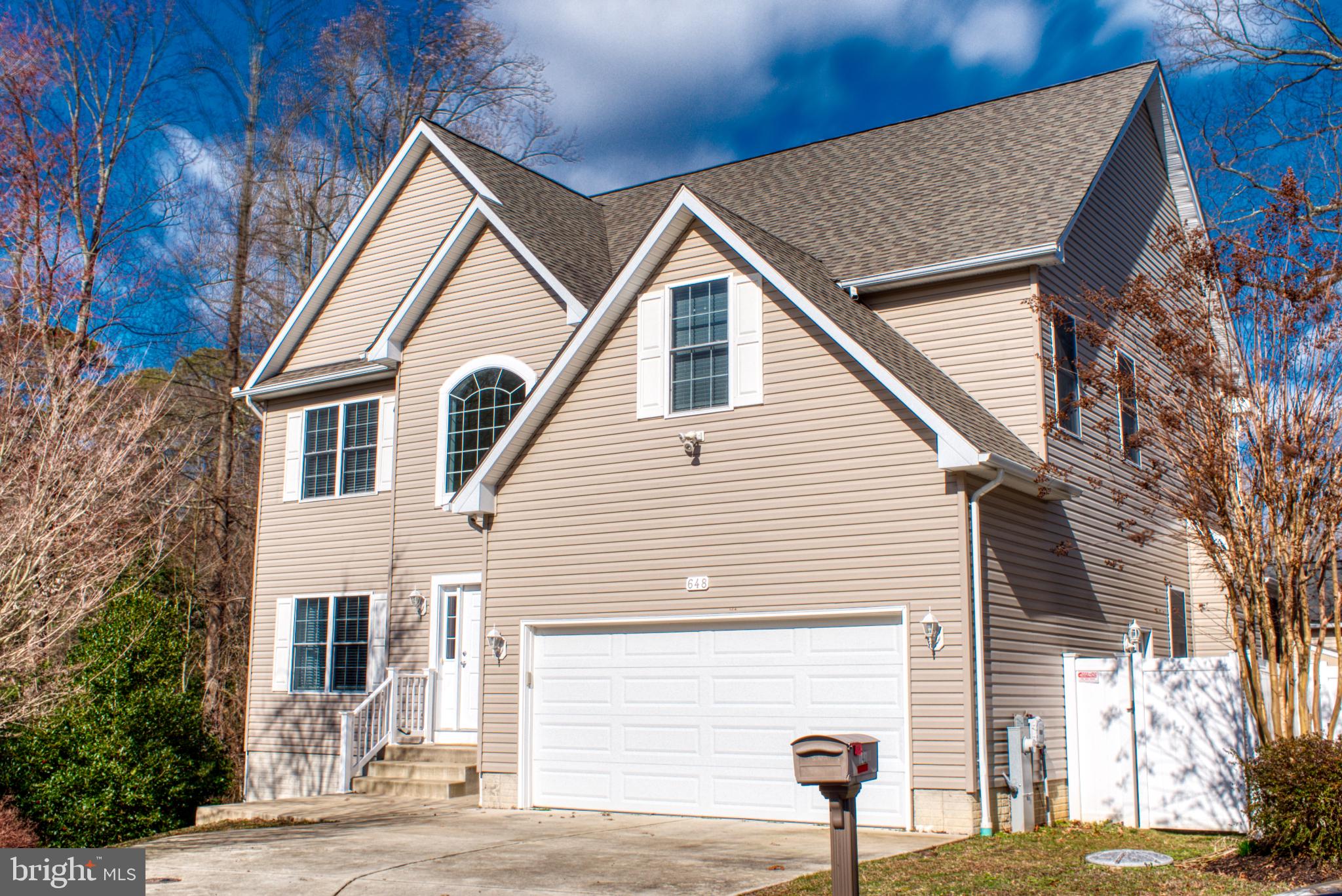 a view of a yard in front of a house