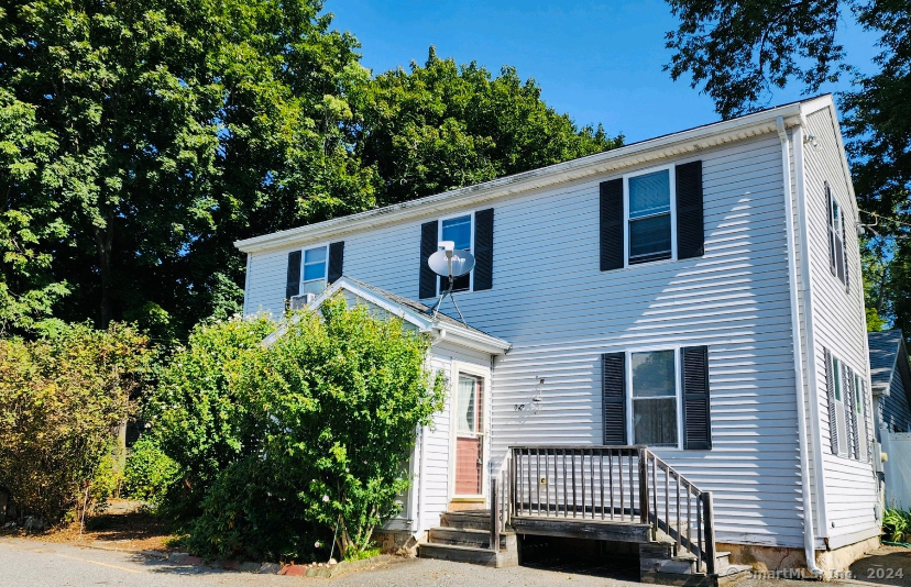 a view of a house with a tree