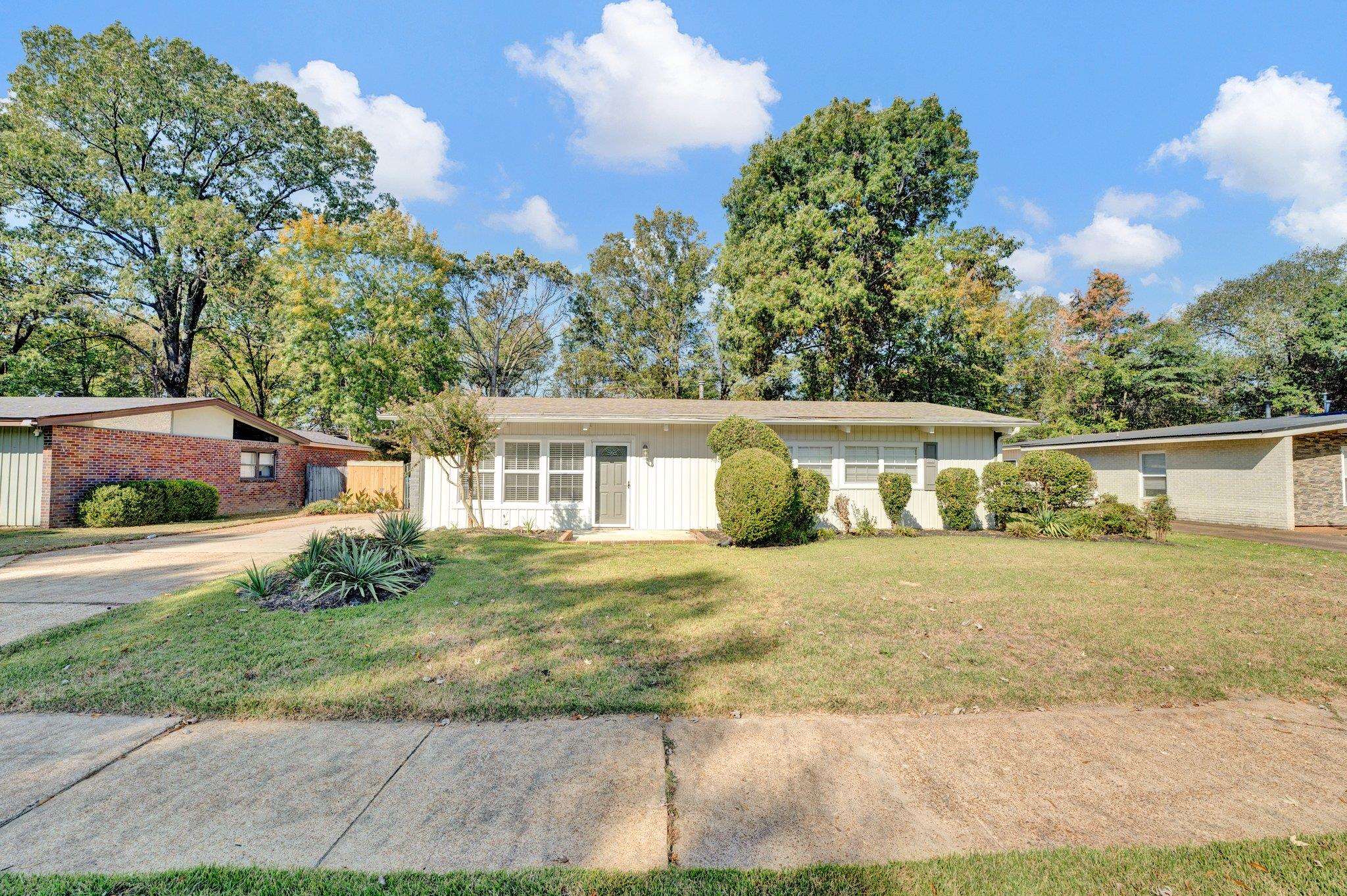 front view of a house with a yard