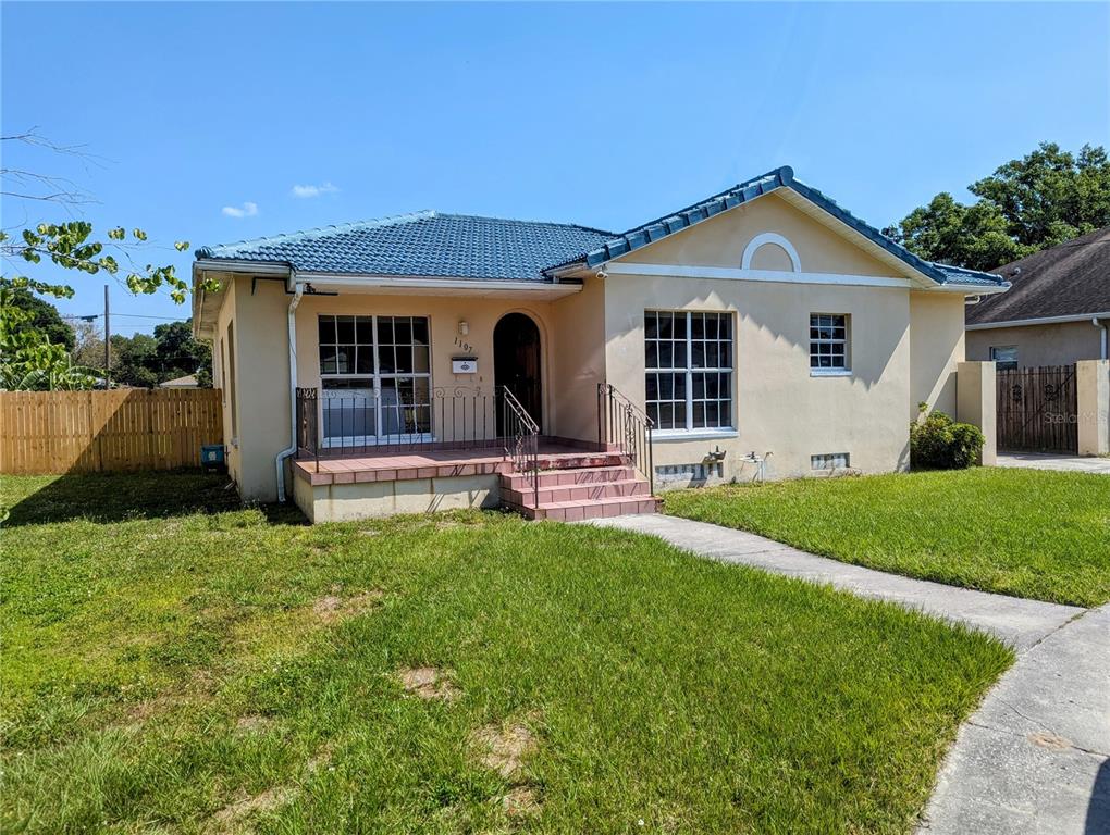 front view of a house with a yard