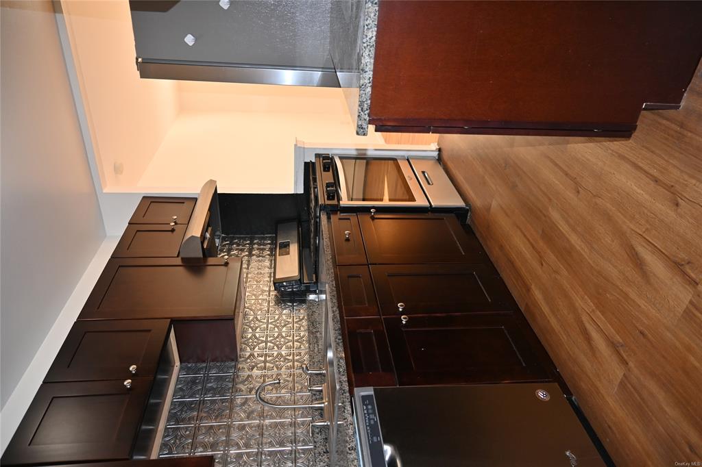 Kitchen with fridge, dishwasher, light hardwood / wood-style floors, and stainless steel range with gas stovetop