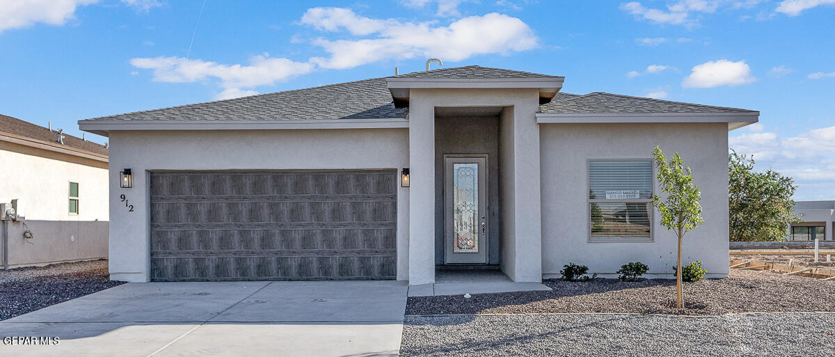 a front view of a house with glass windows