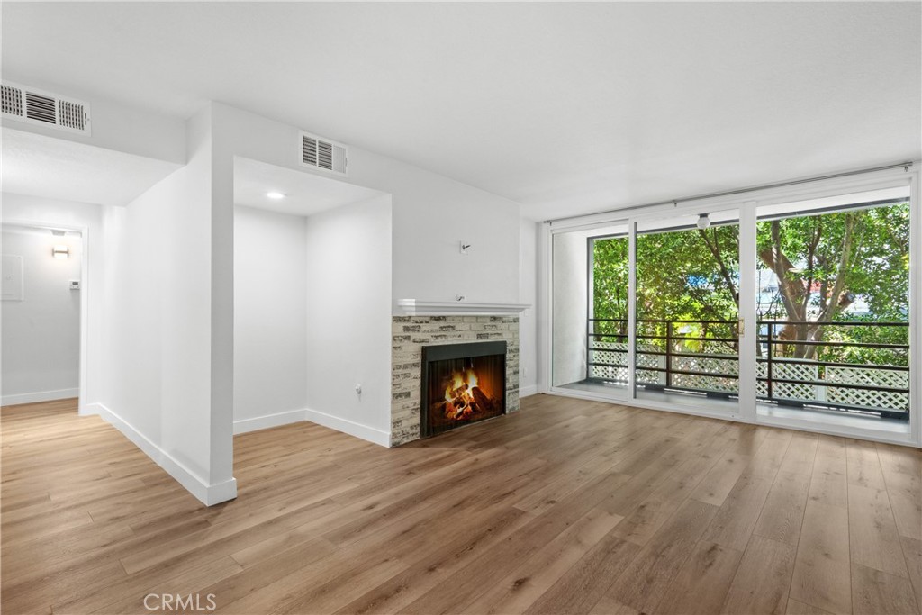 a view of wooden floor fireplace and hardwood floor