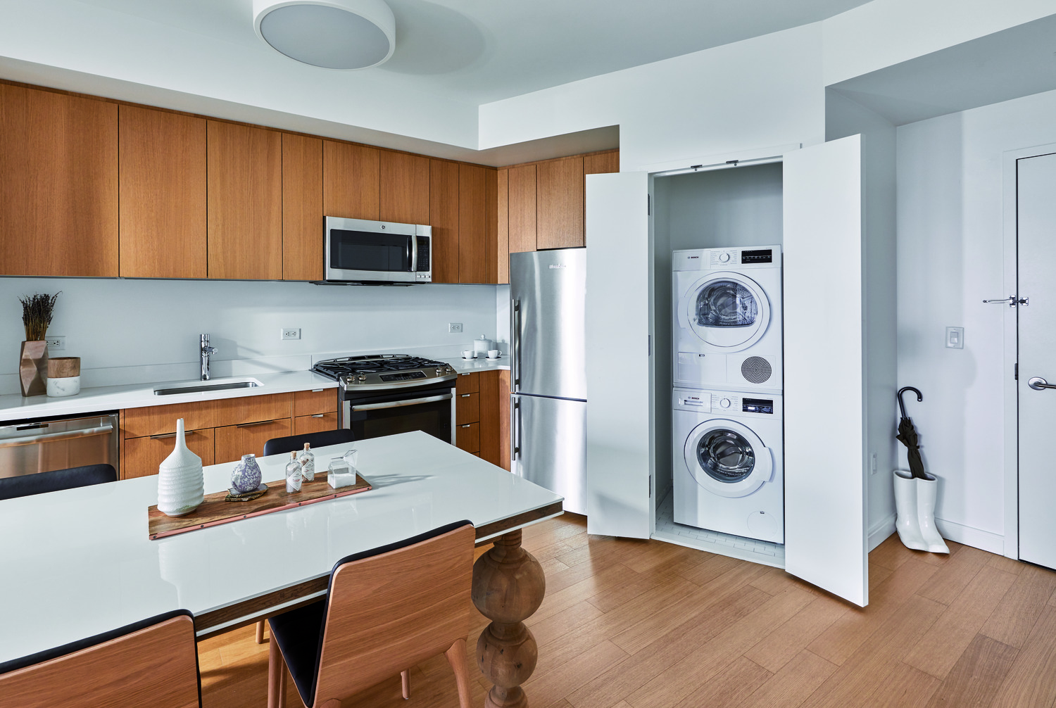 a kitchen with a refrigerator a stove and a sink