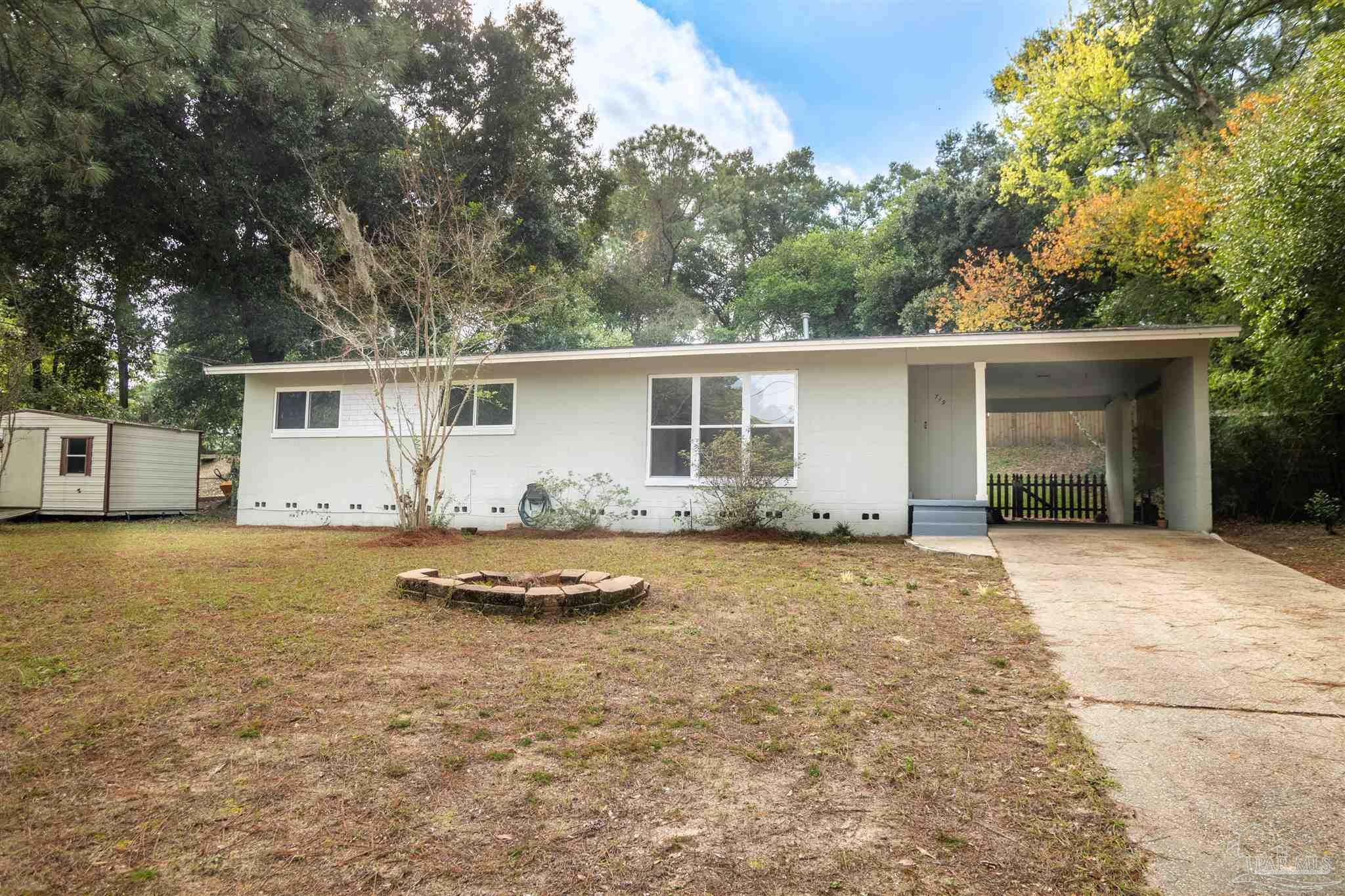 a house with trees in the background