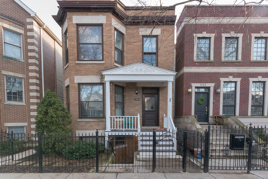 a front view of a brick house many windows