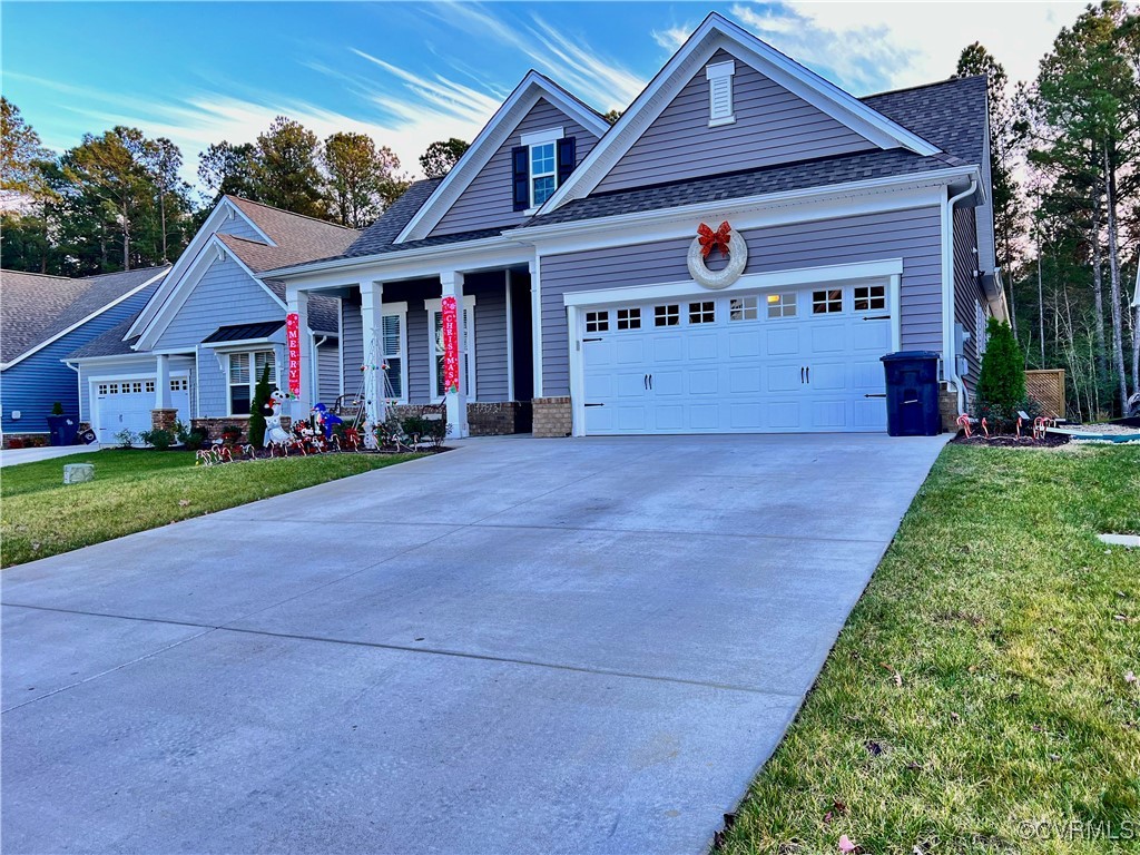 Craftsman-style house featuring a porch, a garage,