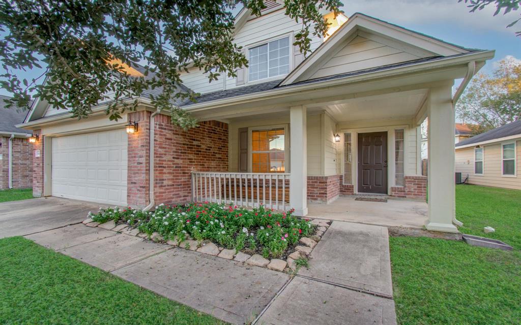 front view of a house with a small yard