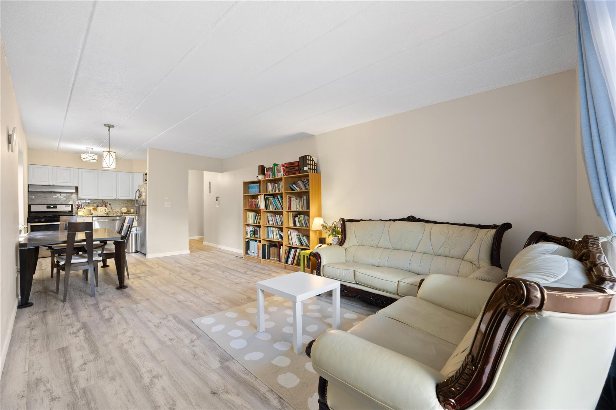 Living room with light hardwood / wood-style floors