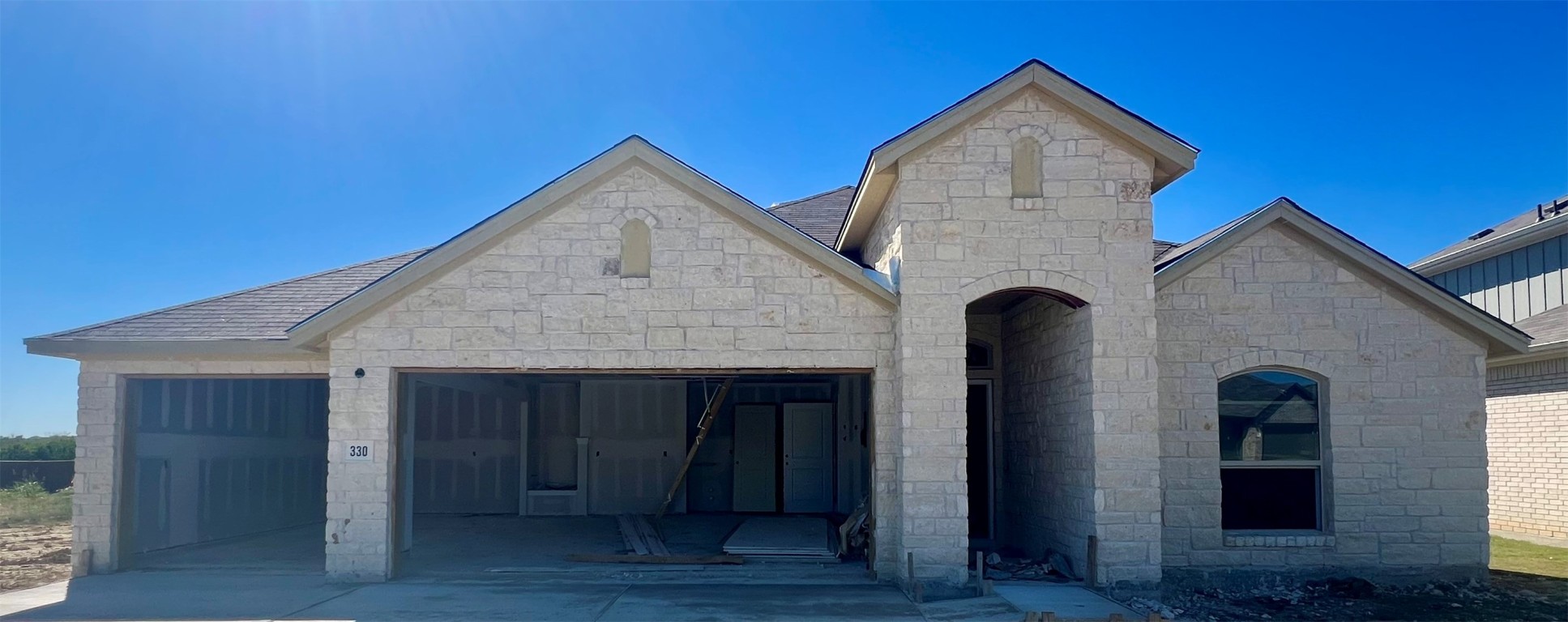 a front view of a house with yard