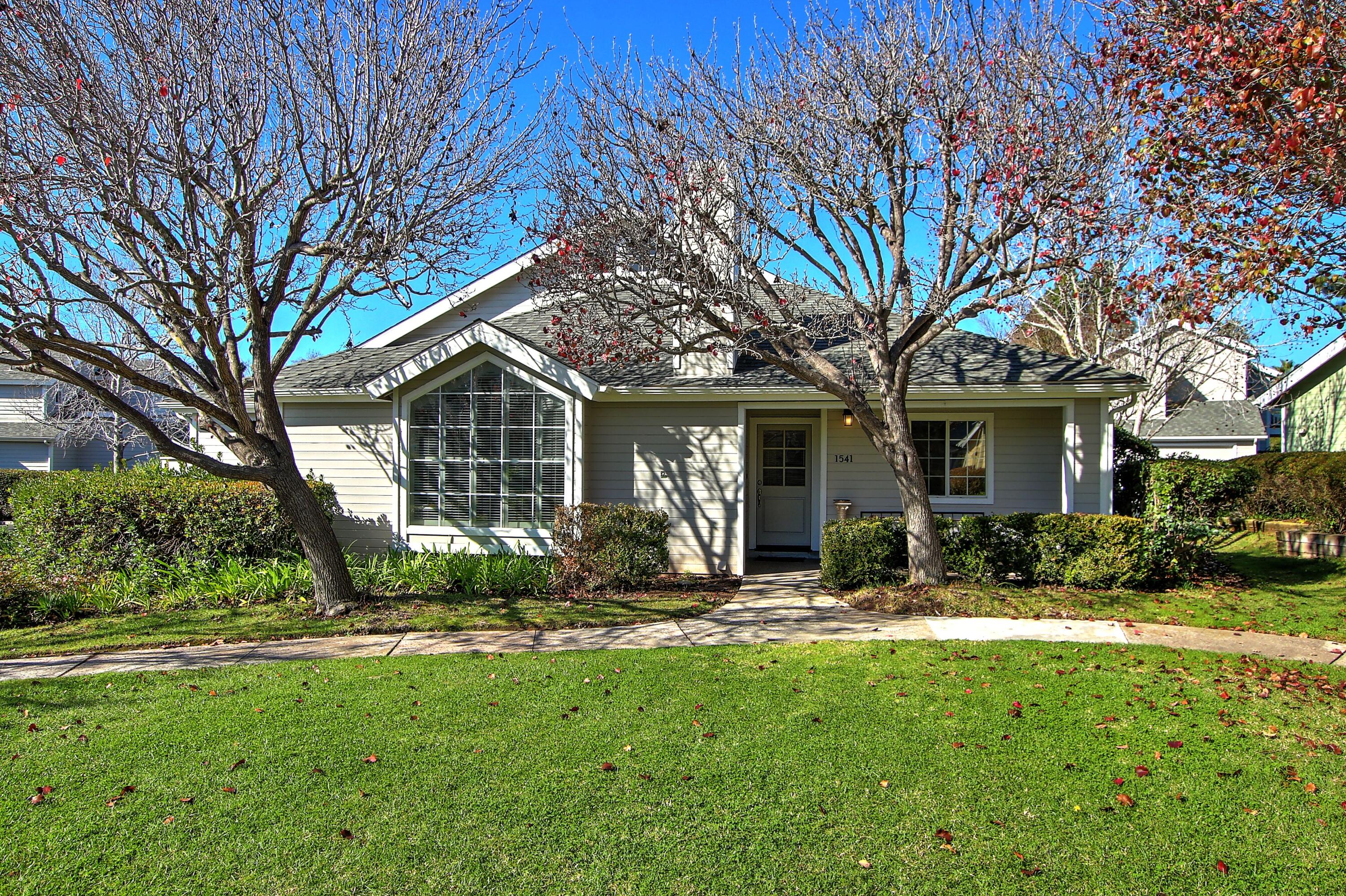 front view of a house with a yard