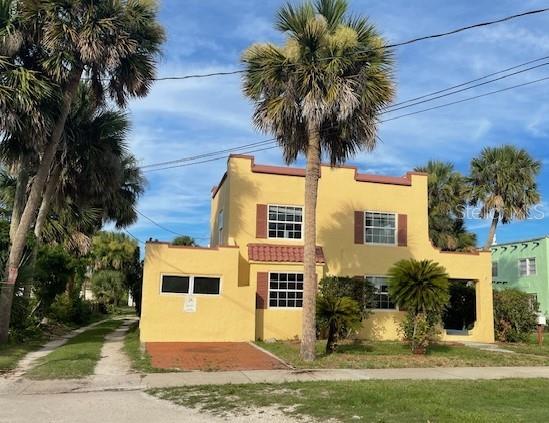 a front view of a house with a yard