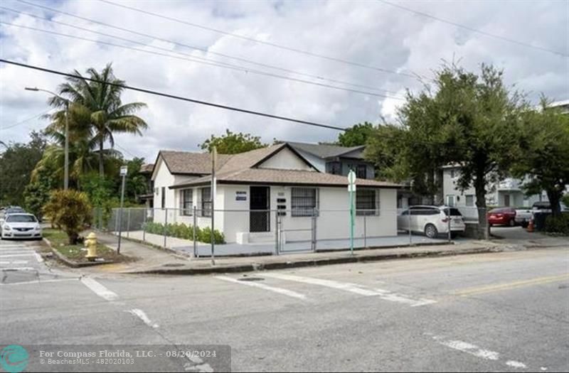 a view of a house with a street