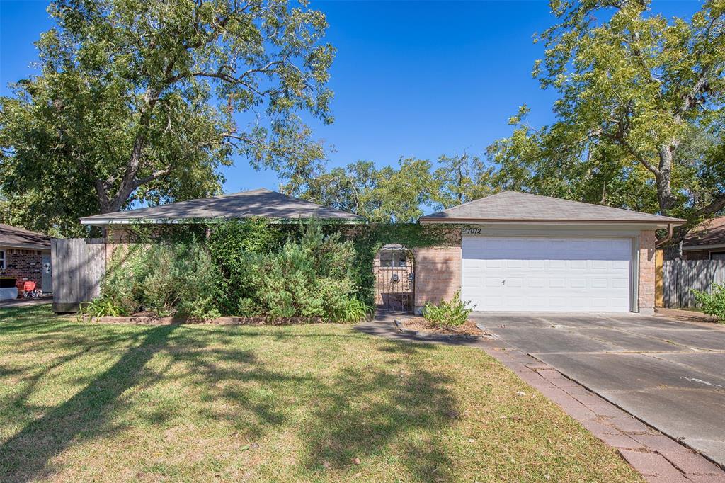 Nestled on a spacious lot, this charming three-bedroom home is a wonderful opportunity to bring your ideas and create a beautiful retreat.