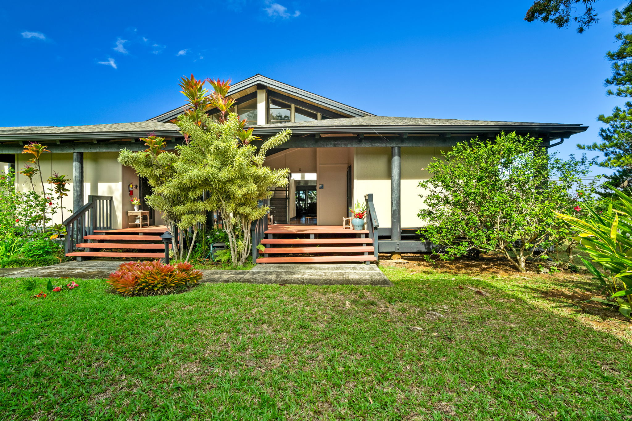 a front view of a house with garden