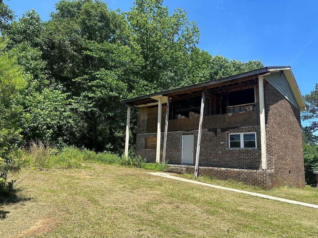 a house with trees in the background