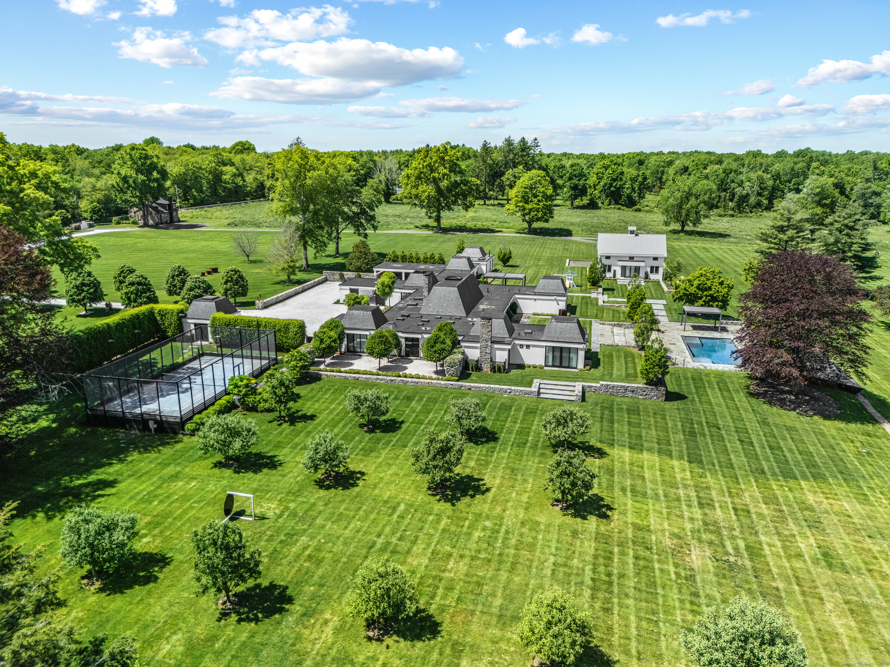 a view of a garden with an outdoor seating