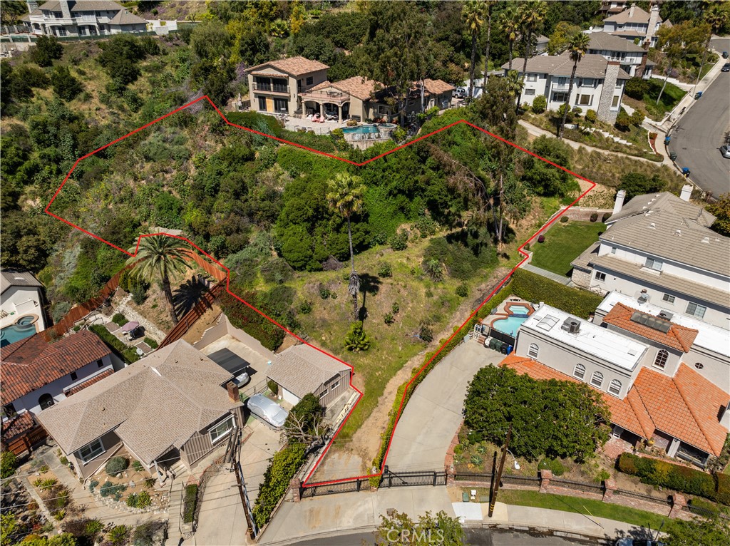 an aerial view of residential house with parking space