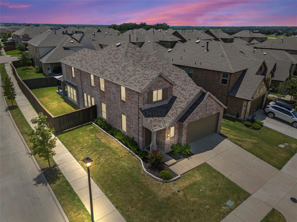 an aerial view of a house with a swimming pool