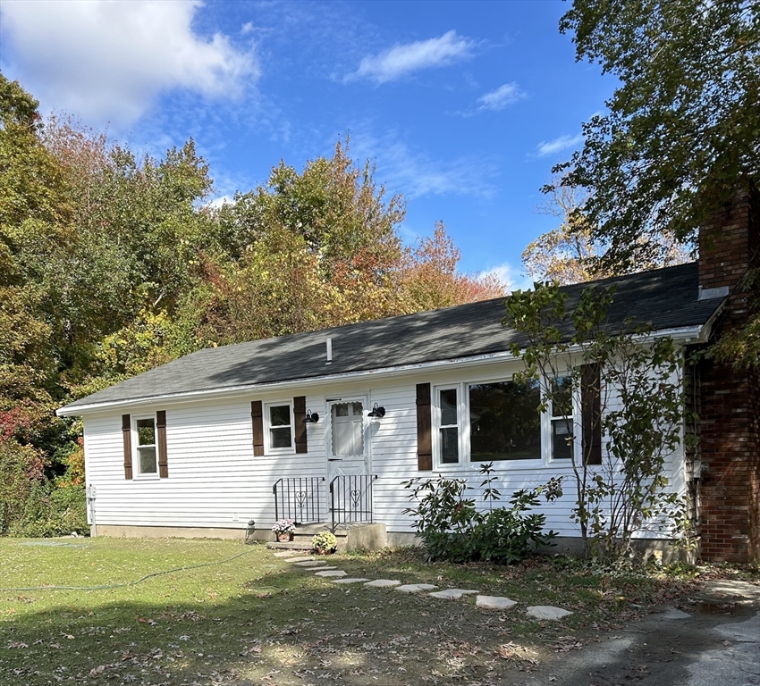 front view of a house with a yard