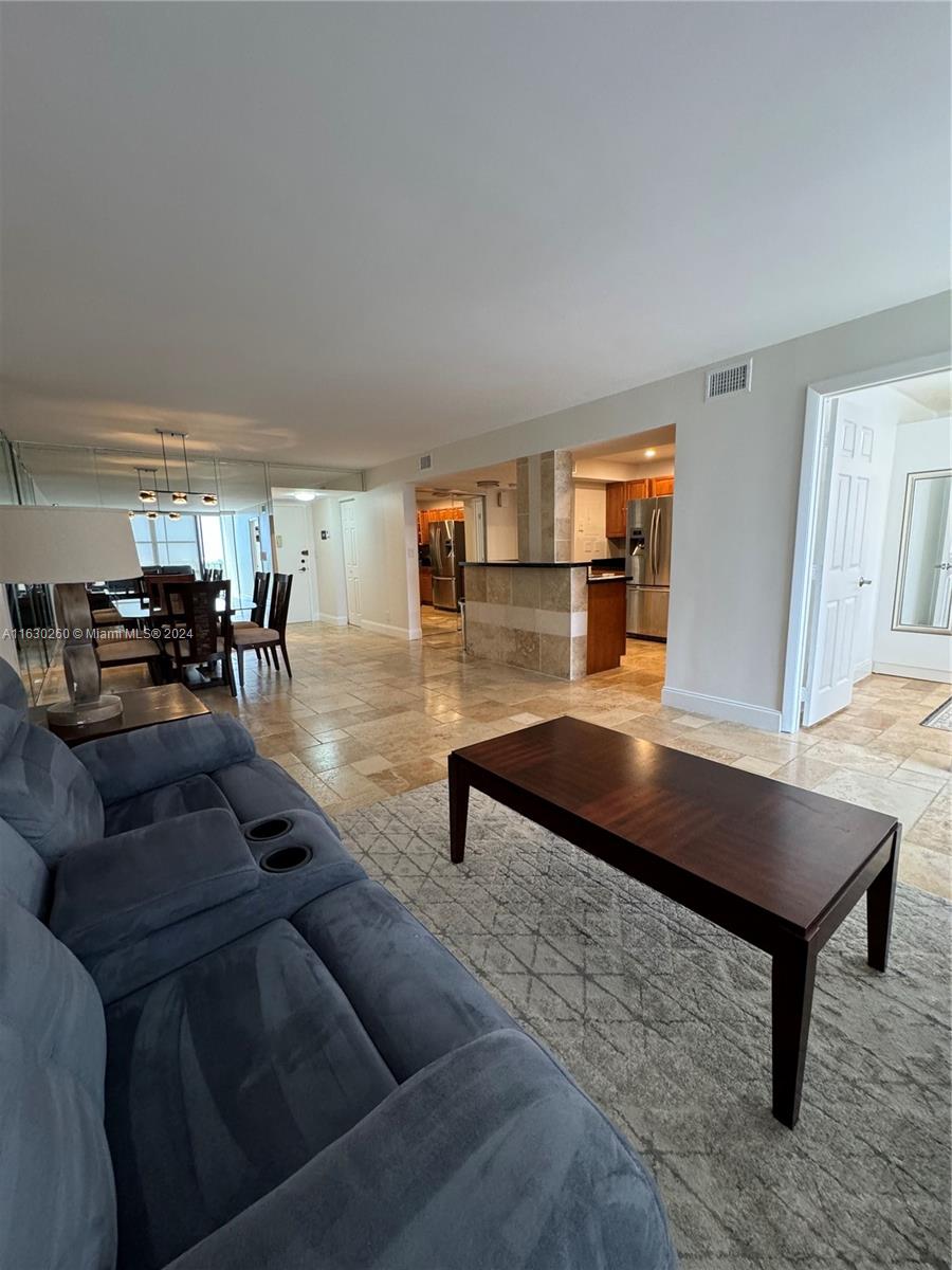 a living room with furniture and a table