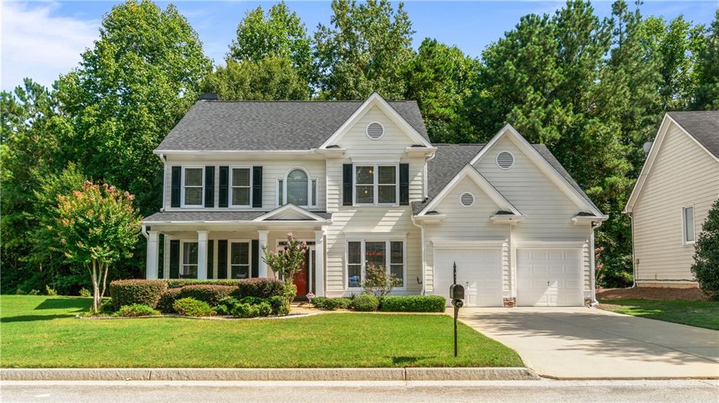 a front view of a house with a yard