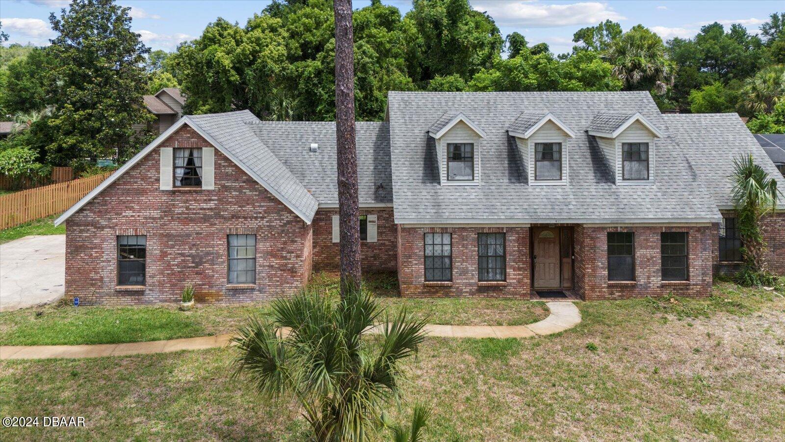 a aerial view of a house with a yard