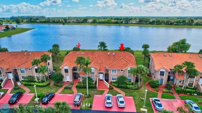 an aerial view of lake residential house with outdoor space and lake view