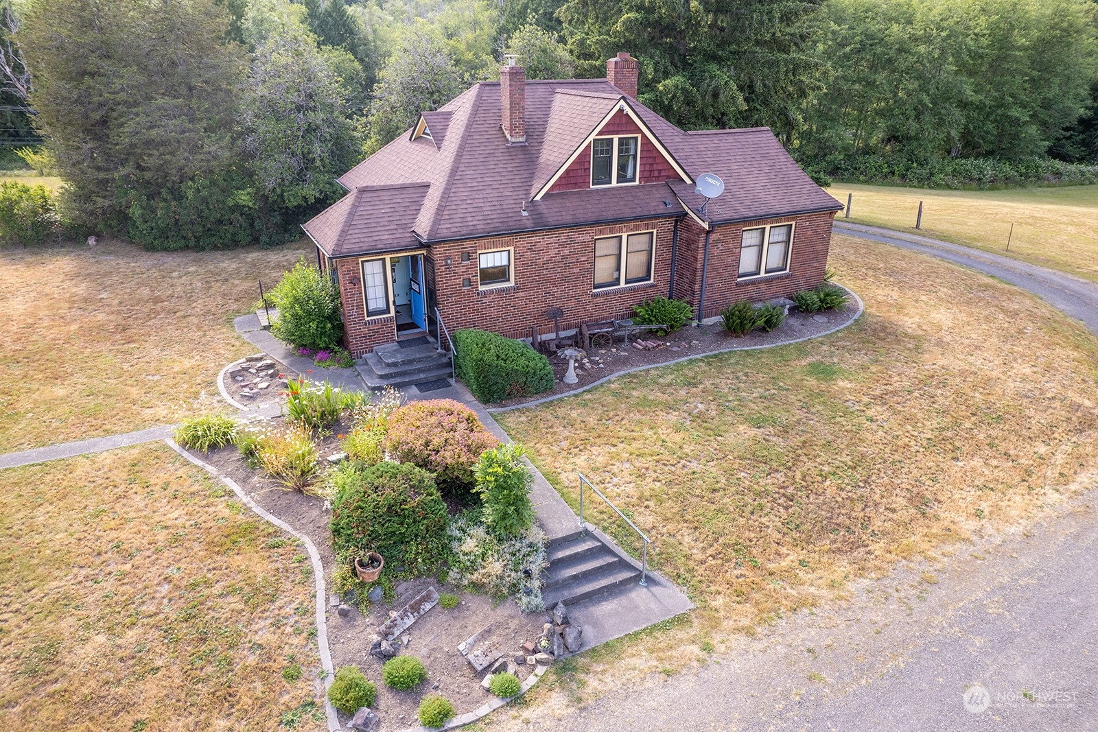 a aerial view of a house with a yard