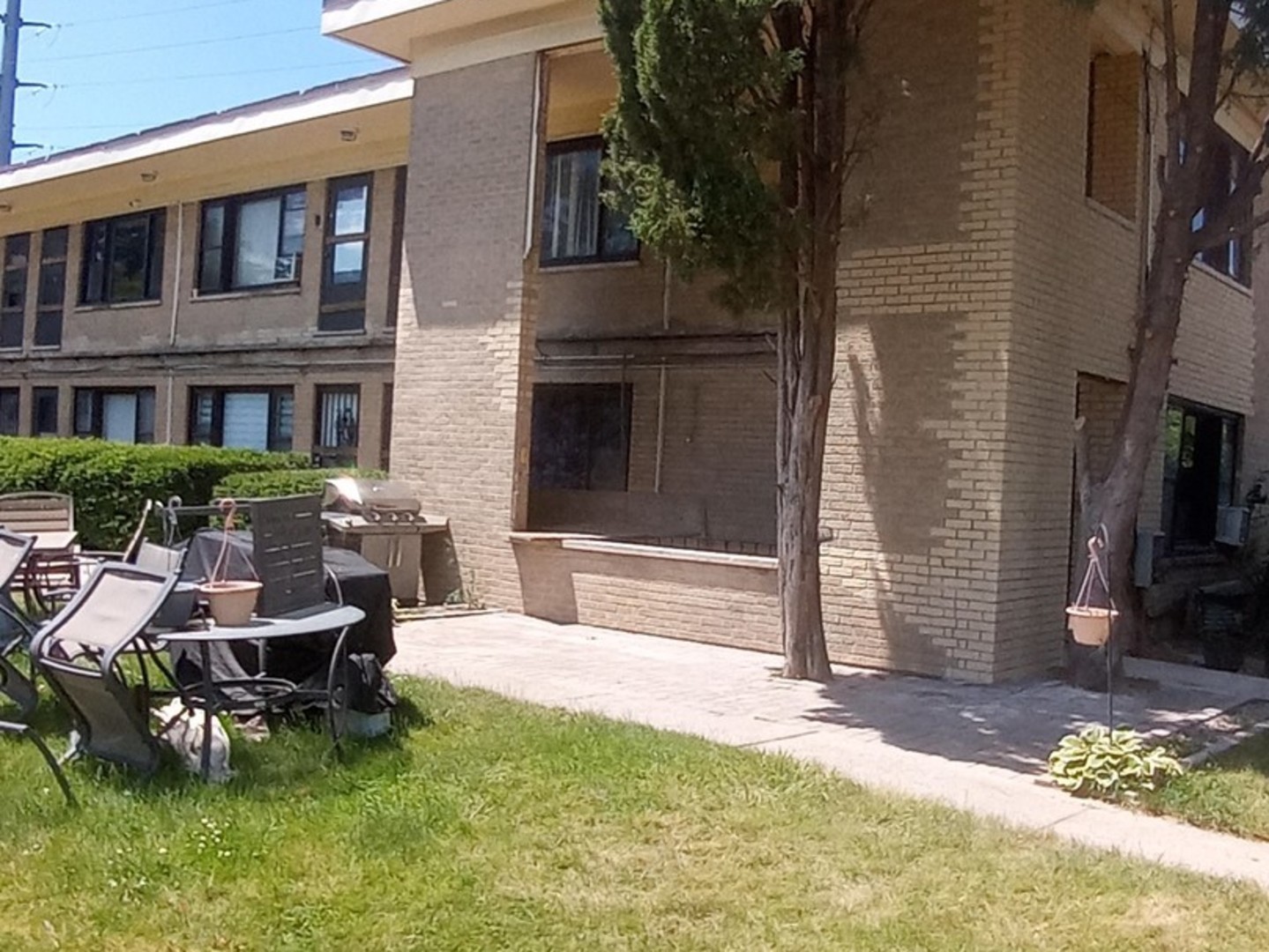 a swimming pool with outdoor seating and yard