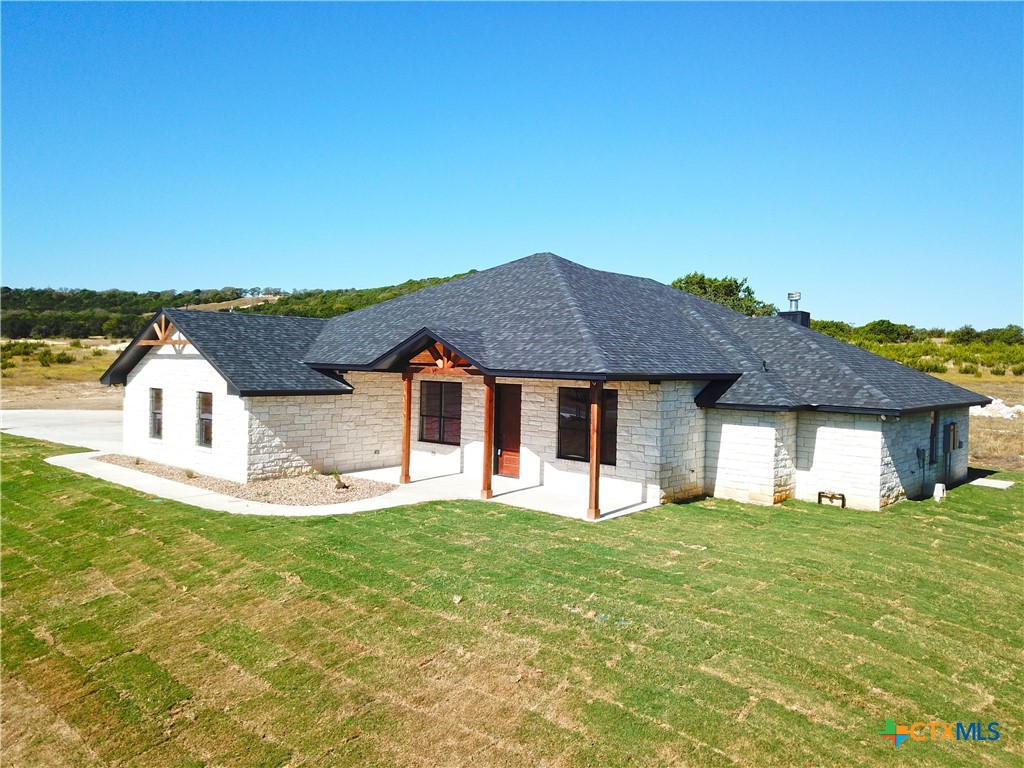 a front view of a house with a yard