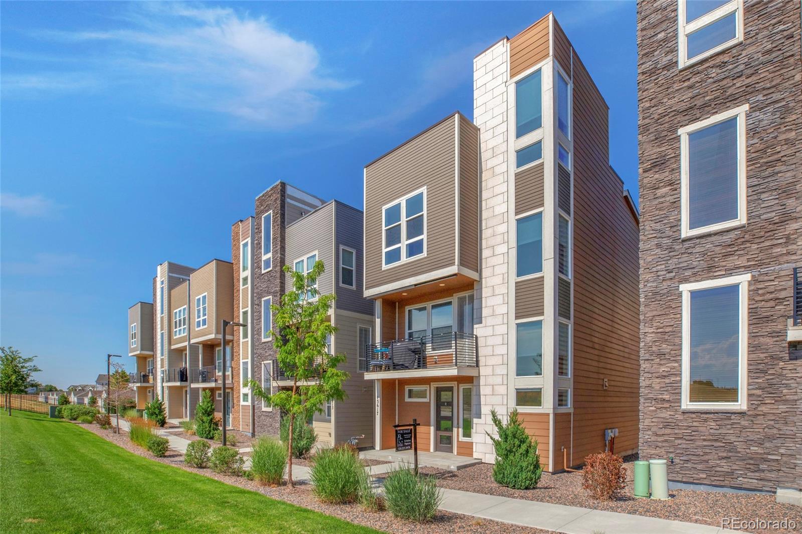 a view of a building next to a yard