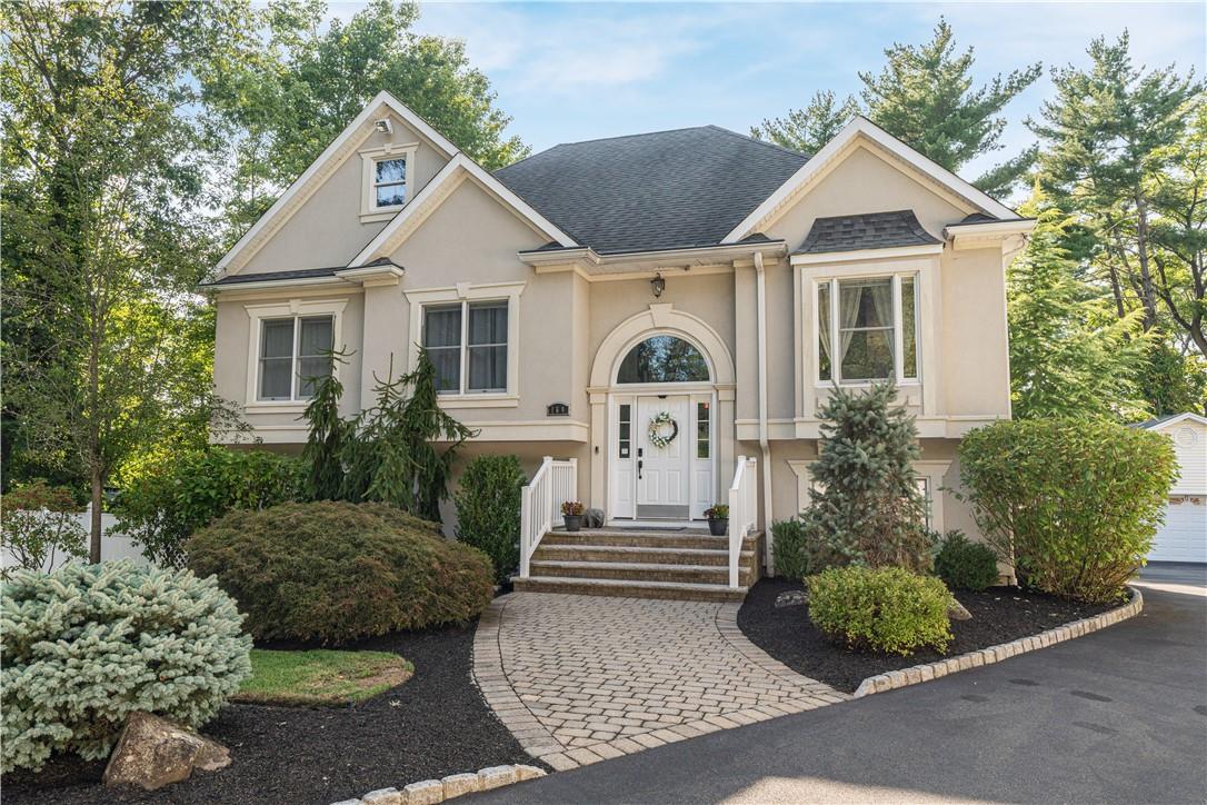 a front view of a house with garden